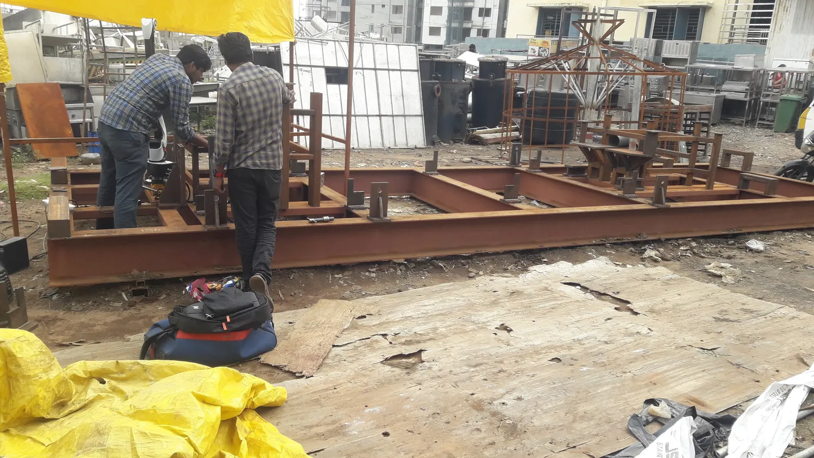 Heavy structural steel base frame under fabrication in the workshop yard