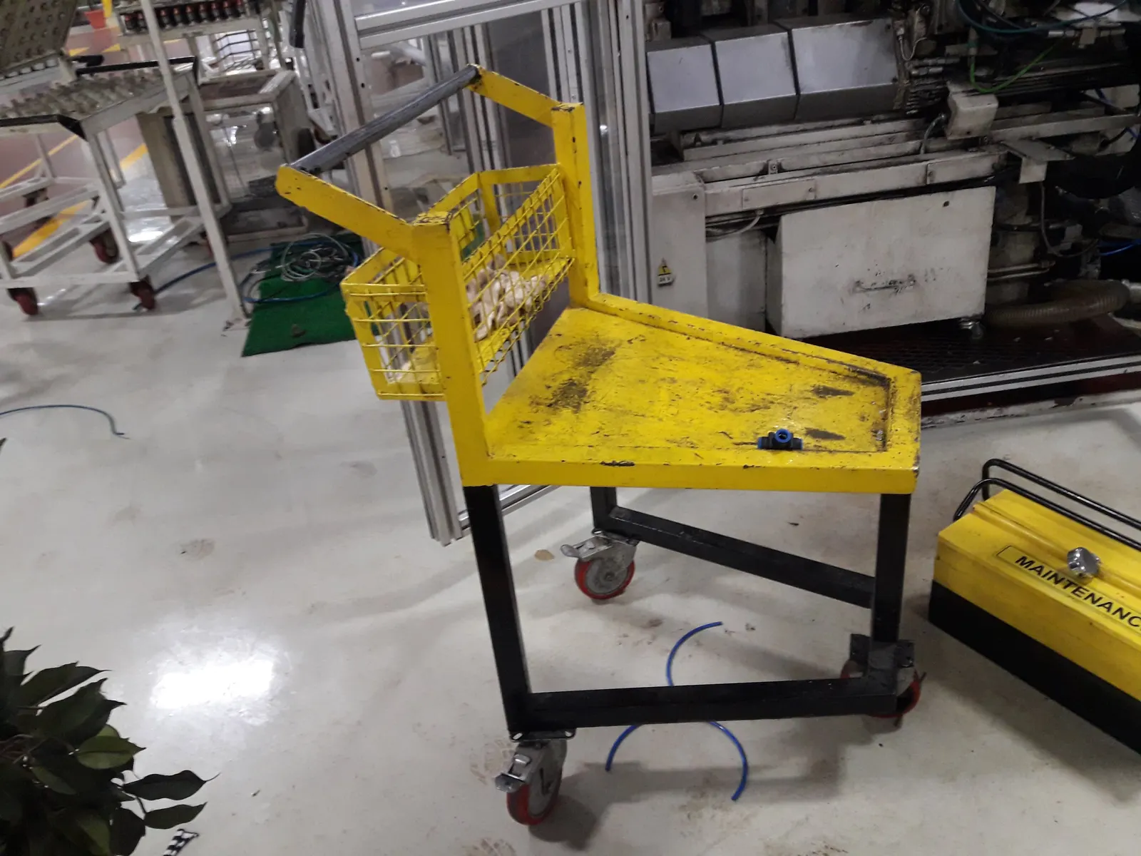 Fabricated material handling trolley in service on a factory production floor
