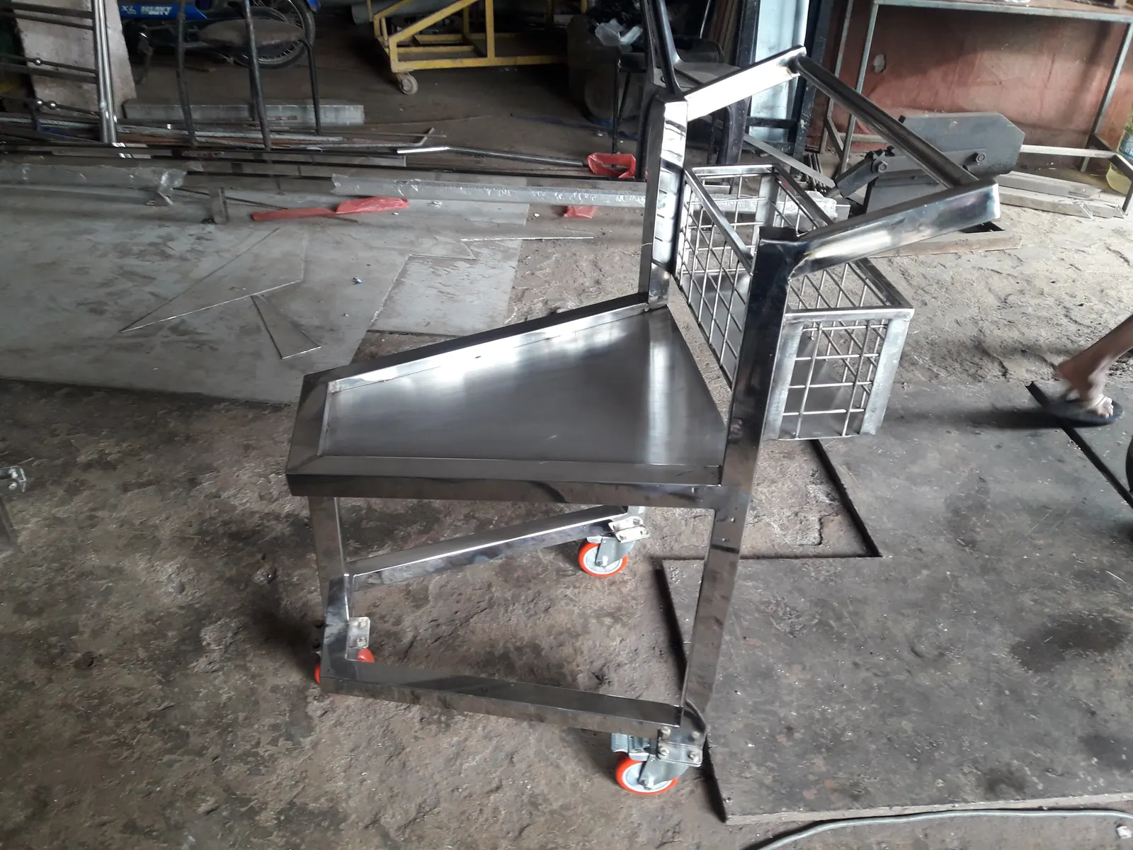 Stainless steel trolley with mesh basket fabricated for factory use